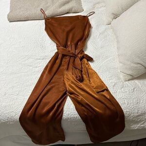 Super cute jumpsuit for fall! From dynamite. Medium